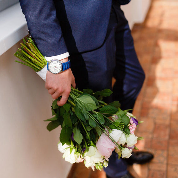 Man in suit with flowers for date