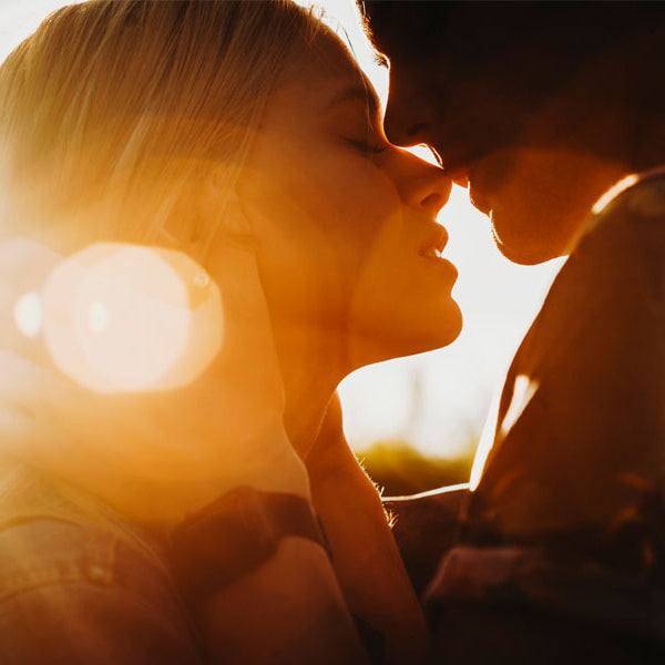 Man and woman kissing in sunlight, erotic story, first time, losing virginity