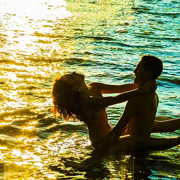 Couple in water embracing, erotic story, Sex On The Beach