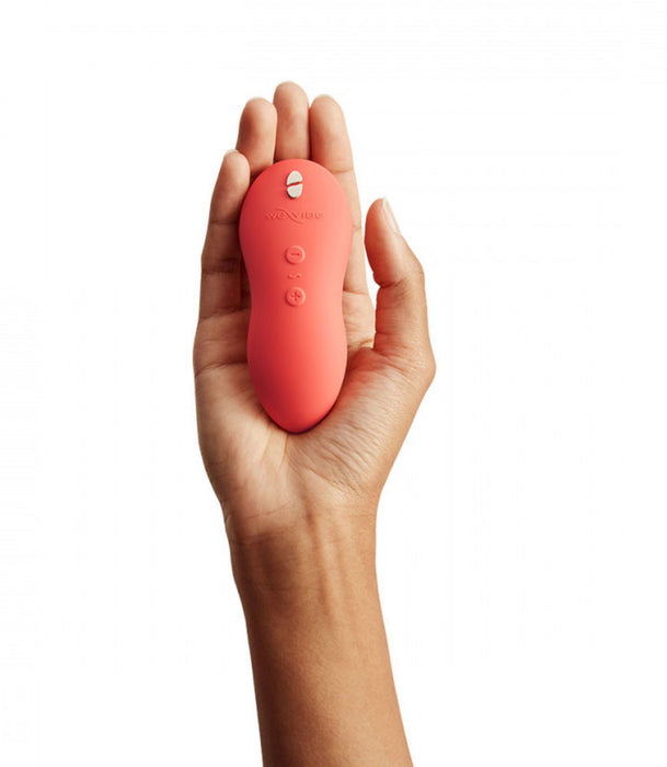 Coral We-Vibe Touch X Lay-On Vibrator In Hand