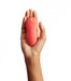 Coral We-Vibe Touch X Lay-On Vibrator In Hand