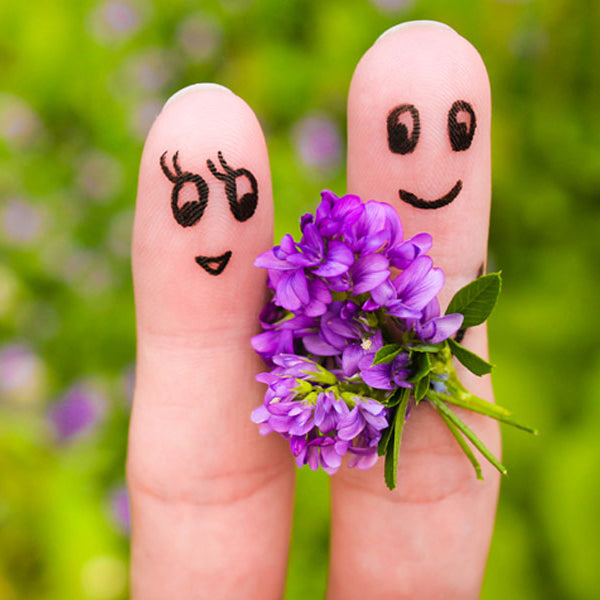 finger puppets, man holding flowers for happy woman, how to ask someone out tips