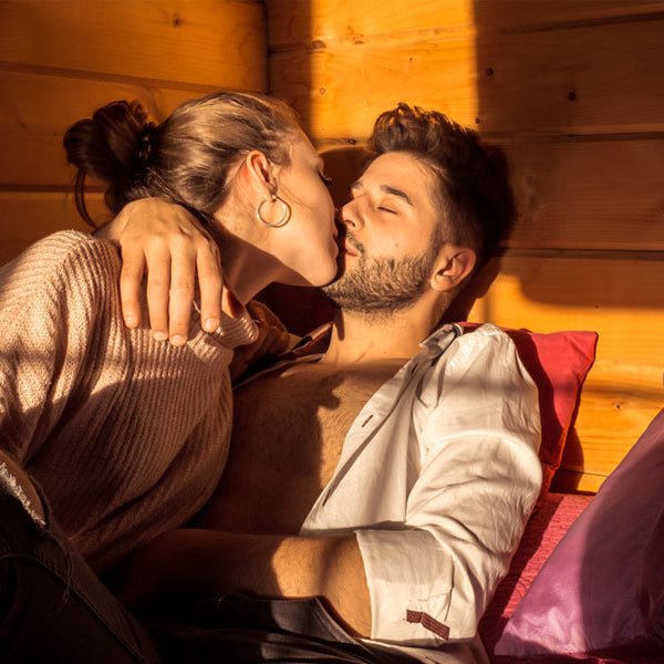 man and woman kissing in bed, cabin sex story 