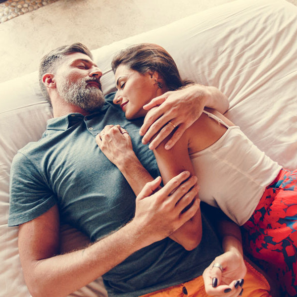 older couple hugging on bed, intimacy after rape