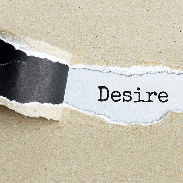 Paper peeled back showing the word desire