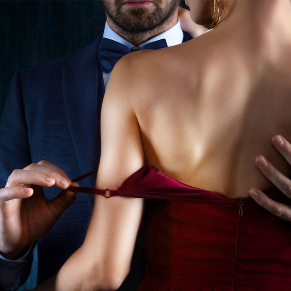 man taking strap off woman's dress, erotic story
