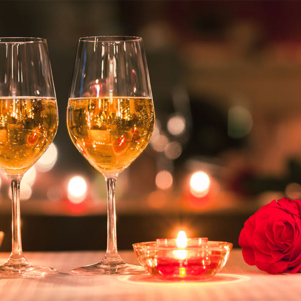 wine glasses, rose, candles, seducing her story