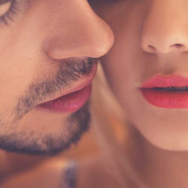 Man about to kiss a woman