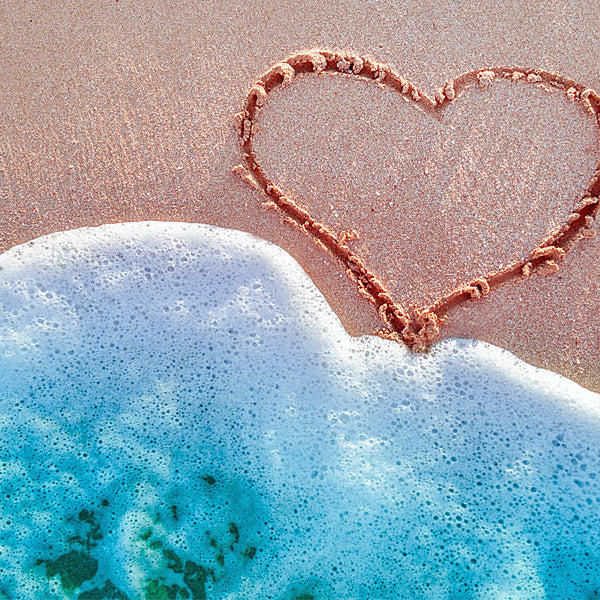Beach with heart and wave of water