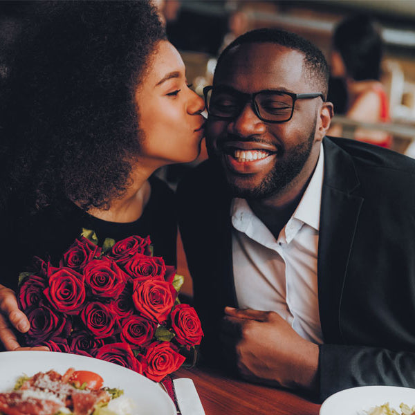 black man, black woman at table kiss on cheek, table sex story